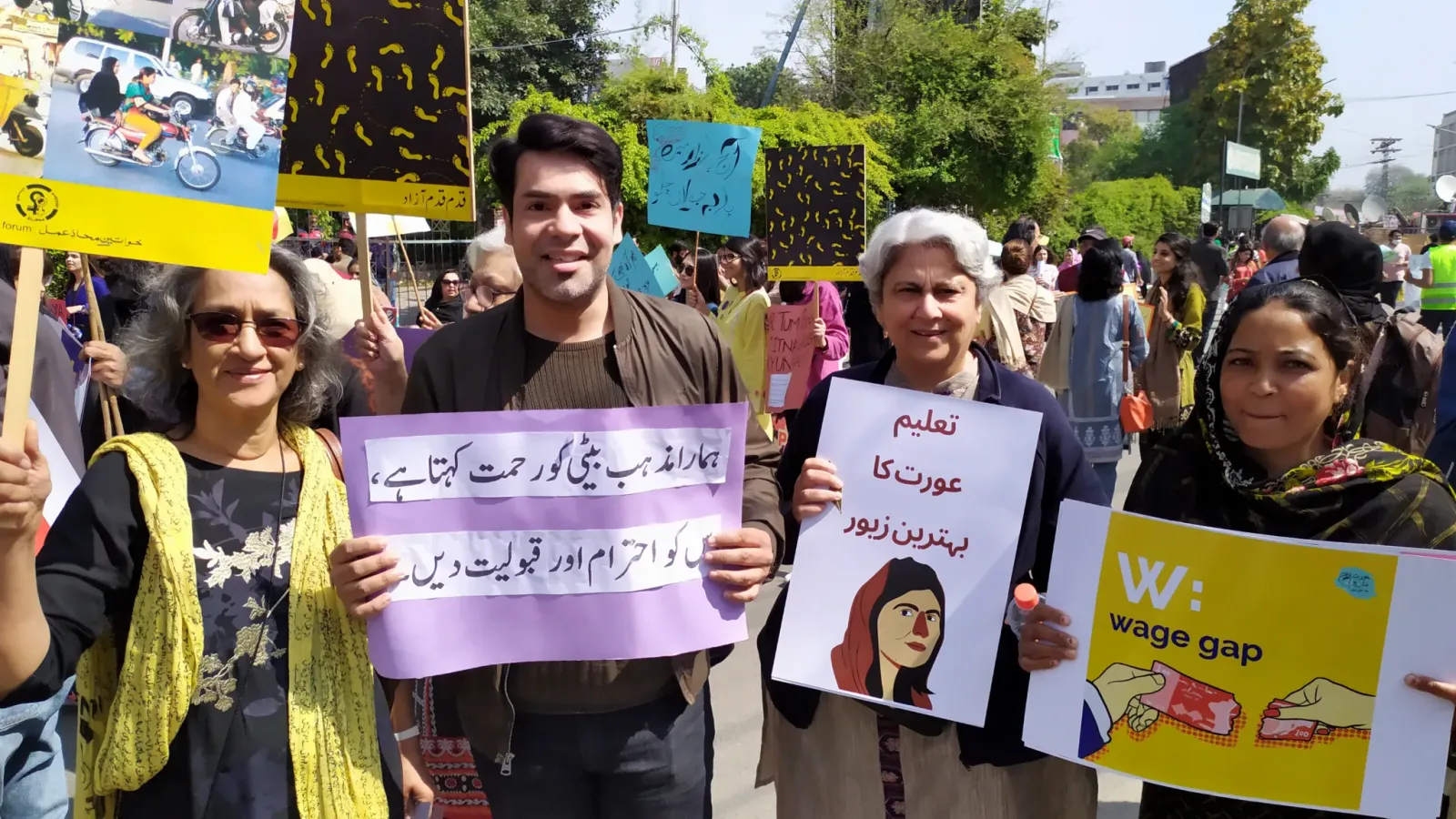 Marchers holding placards during Aurat March 2020 // Image Credits: Nawab Afridi