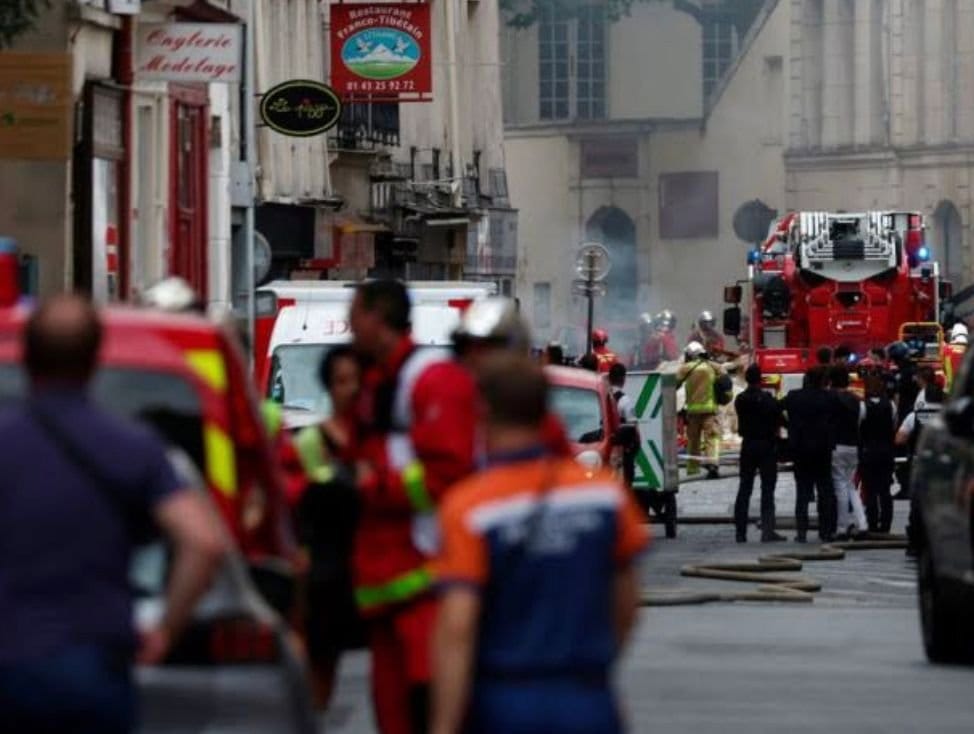 French firefighters and rescue forces work after several buildings on fire following a gas explosion in the fifth arrondissem