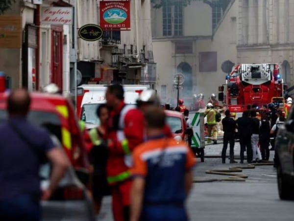French firefighters and rescue forces work after several buildings on fire following a gas explosion in the fifth arrondissem