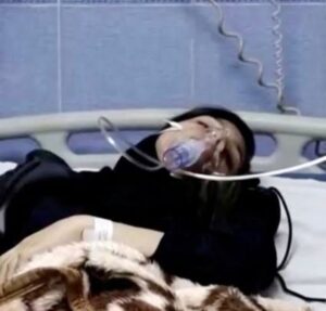 A young woman lies in hospital after reports of poisoning at an unspecified location in Iran in this still image from video from March 2, 2023. Photo