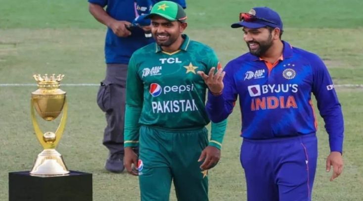 Pakistani cricket team captain Babar Azam (left) and Indian captain Rohit Sharma while speaking during a match day